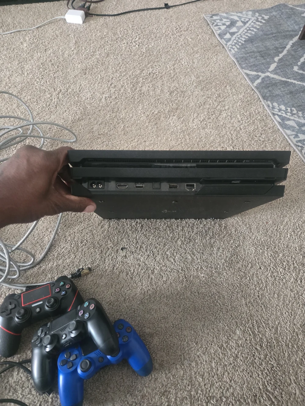 Sony 4 Slim Console with Black, Red-Accented, and Blue DualShock Controllers